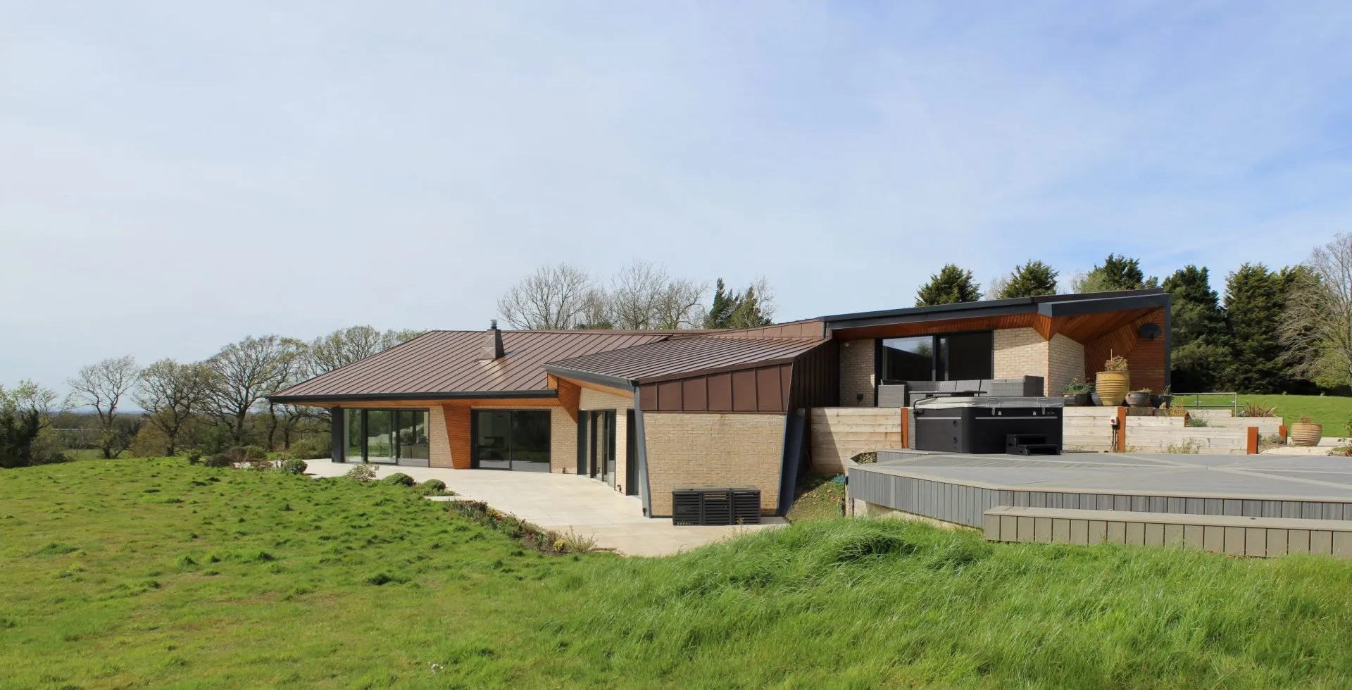 Weald House from the garden, integrated landscape and external materials