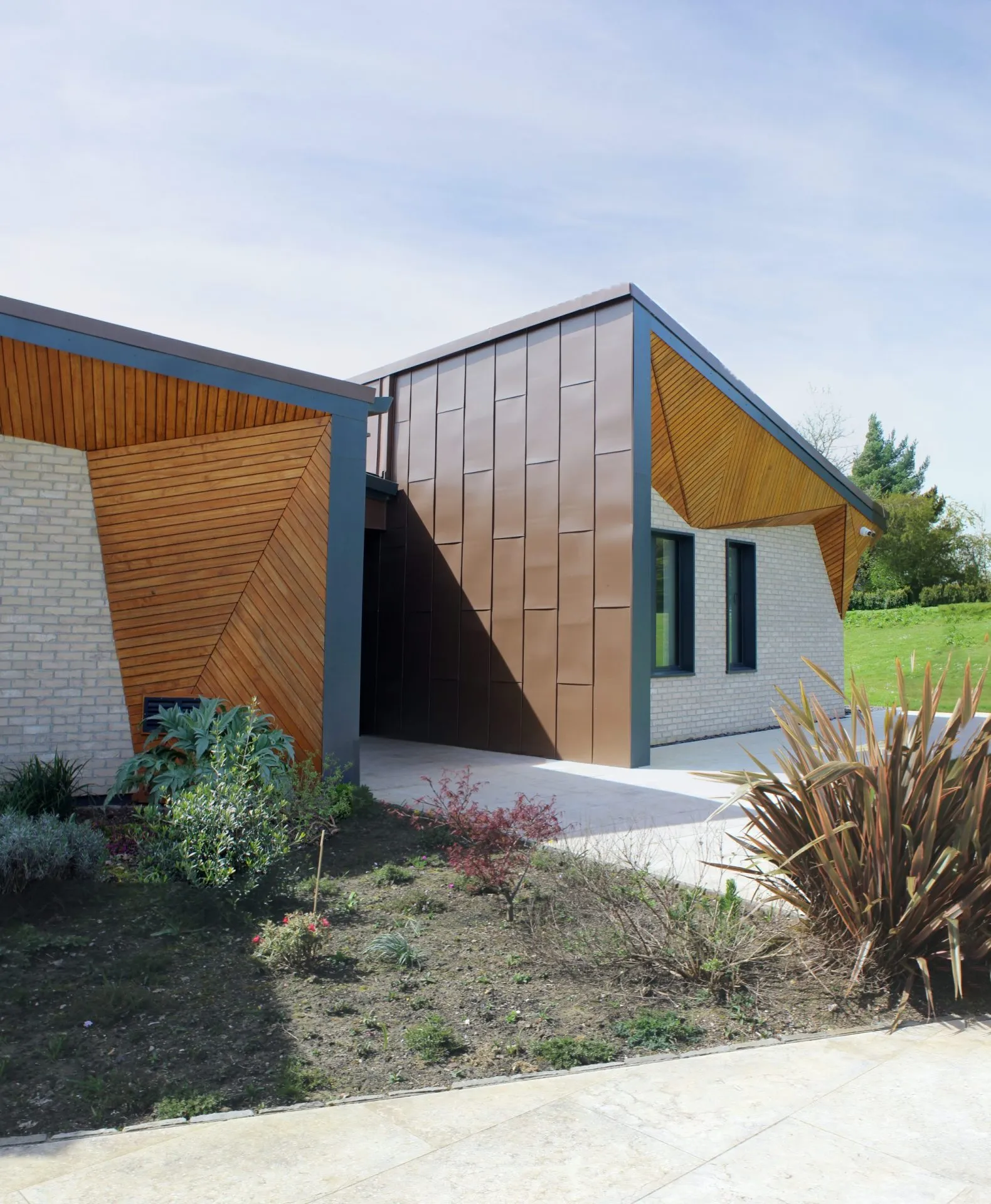 Weald House detail elevation, larch cladding and roof junction